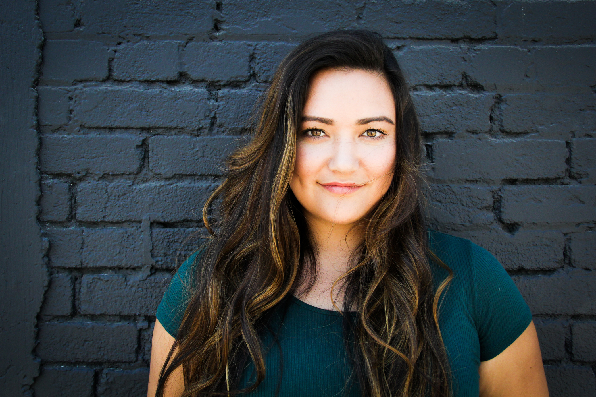 Close-Up Photography of a Woman Near Wall